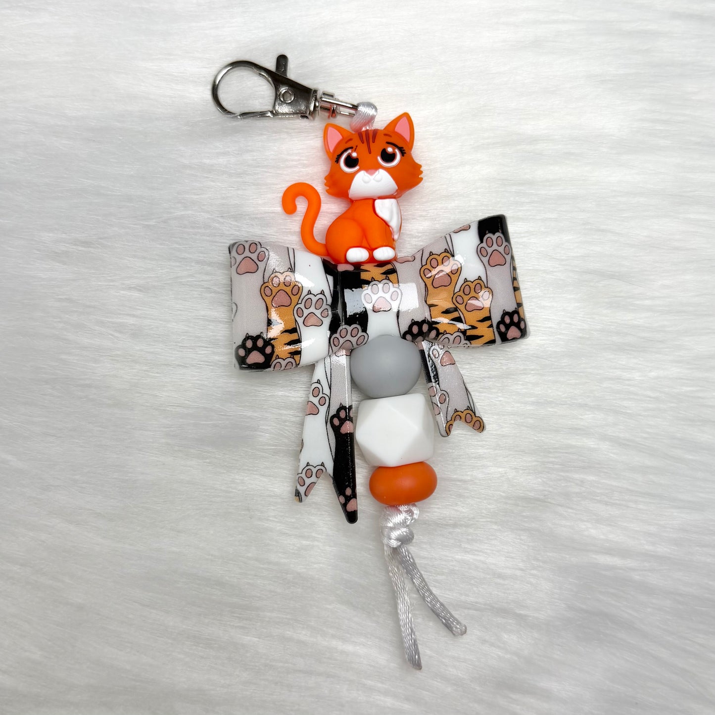 ORANGE CAT AND PAW BOW KEYCHAIN/ZIPPER PULL