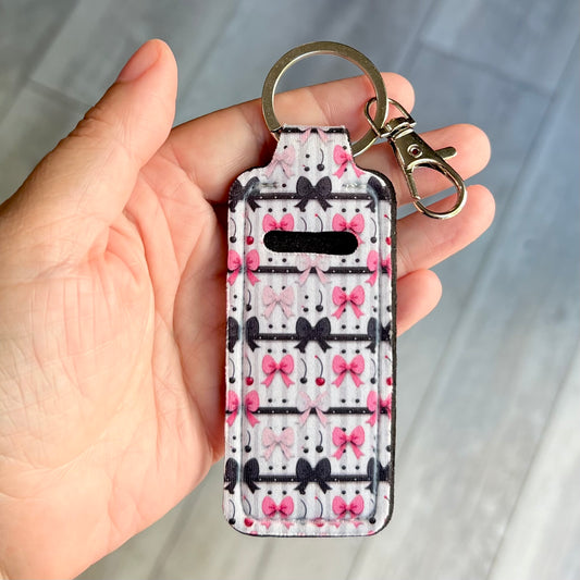Pink and black bows - lip balm holder keychain