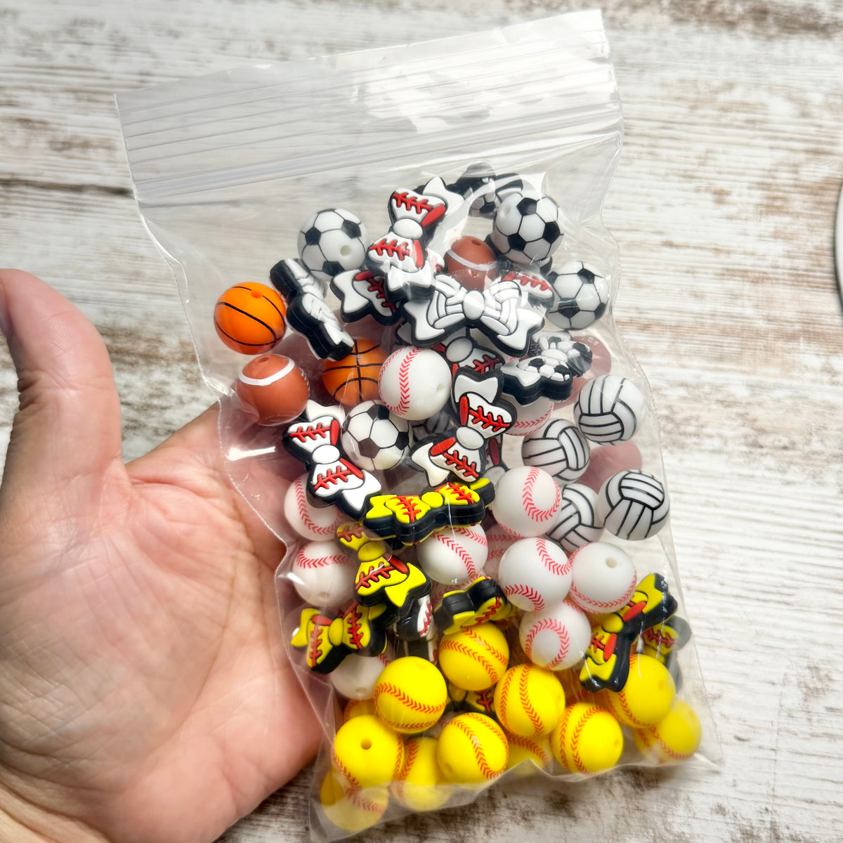 DESTASH PRICED - 15mm and bows silicone beads sports mix (68 count)